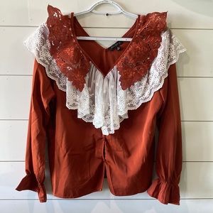 ALY DALY. Blouse. Lace around neck line.